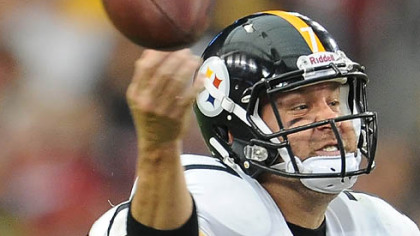 Quarterback Ben Roethlisberger is hit as he attempts to pass in the fourth quarter.