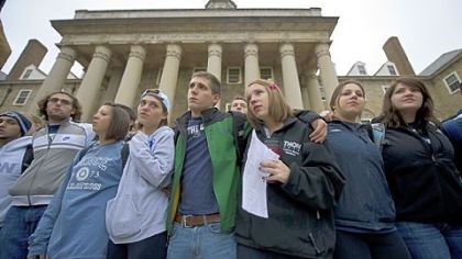 Penn State University students gather Thursday at Old Main, the school's administration building at the center of the campus, to express solidarity for the victims in the child abuse scandal involving former Penn State football coach Jerry Sandusky. Their vigil was a contrast to the rioting by students Wednesday night in reaction to head football coach Joe Paterno being fired as part of the university's reaction to the scandal.