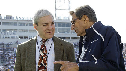 Penn State President Graham Spanier, left, talks with Coach Joe Paterno before a football game against Iowa in October in Beaver Stadium.