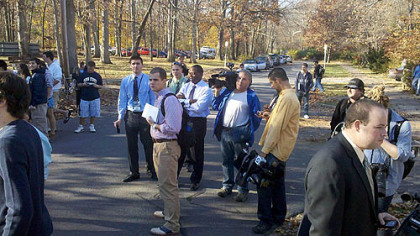 Members of the media wait outside Coach Joe Paterno's house in State College for Mr. Paterno to make a statement.