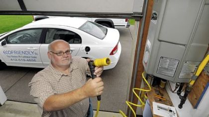 Paul Gianakas' EcoFriendly LLC installs natural gas fueling stations at homes and businesses. He has a fueling station in his own garage, which compresses natural gas from his home's service line to fuel his Honda Civic.