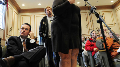 Mayor Luke Ravenstahl, left, listens as Elizabeth Beroes of Shadyside talks about 8 feet of water that flooded her basement in 2009. The community hearing on East End flooding was held Tuesday at Winchester Thurston School in Shadyside.