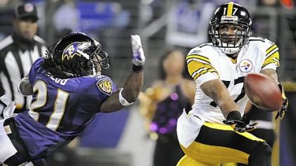 Steelers Mike Wallace stretches for a ball behind Ravens defensive back Lardarius Webb in the first Steelers-Ravens game in 2010. Wallace believes the Steelers wide receivers are too fast for Baltimore.