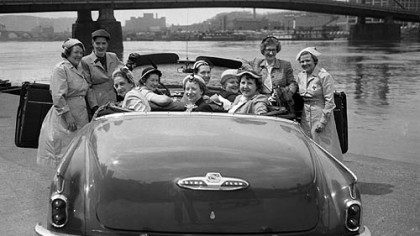 After America emerged from World War II, middle-class living standards rose steadily, driven by pent-up demand for housing, appliances and cars. It's all captured in this 1952 scene on the Allegheny, as several women gathered for lunch around their shiny Buick convertible.