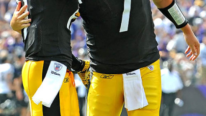 Steelers quarterback Ben Roethlisberger hugs Mike Wallace after throwing a touchdown against the Ravens.