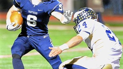 Franklin Regional wide receiver Mark Nicholas tries to fend off Hopewell's Adam Murray in the first half Friday at Fox Chapel High School.