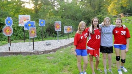Four members of Girl Scouts Troop 50310 create a Panhandle Trail memorial in Rennerdale to children killed on two of the four planes involved in the 9/11 terrorists attacks. Children died on Flight 175 when it struck the World Trade Center and Flight 77, which crashed into the Pentagon. Left to right are: Brittany Reindtler, Ellen Murphy, Sarah Dobbins and Katie Linner.