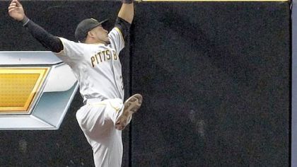 Left fielder Xavier Paul can't come up with a home run hit by Milwaukee's Jonathan Lucroy in the third inning.