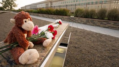 Mementos at a memorial bench at the Pentagon.