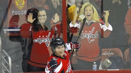 Washington's Nicklas Backstrom, back, scored in overtime to beat Anaheim Tuesday, 5-4. He celebrates with teammate Alex Ovechkin.