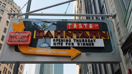 A neon sign welcomes patrons to Taste of Dahntahn.