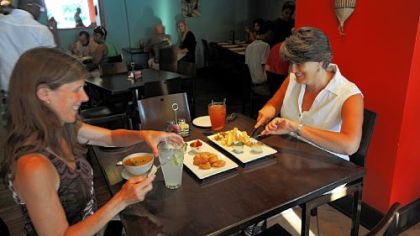 Cheri High Beckford (left) of Regent Square and Paola Scommegna of Highland Park dine at Alma Pan-Latin Kitchen. They started with heirloom tomato gazpacho, platanos maduros con salsa de habichuelas (sweet, ripe plantains with spicy bean sauce) and Yuca frita con salsitas de Alma (Crispy yuca served with aji and cilantro/jalapeno sauces).