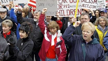 Protesters take part in a Tax Day rally on April 15, 2009, on Fountain Square in Cincinnati. Protesters gathered at state capitols and in neighborhoods and town squares across the country that day to kick off a series of tax-day protests designed to echo the rebellion of the Boston Tea Party.