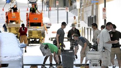 The IMAX camera's dolly track is taken down to prepare for a new shot on snow-covered Oliver Avenue.
