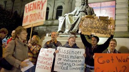 Protesters outside the Carnegie Music Hall in Oakland on Wednesday night rallied against Henry A. Kissinger's visit to Pittsburgh.