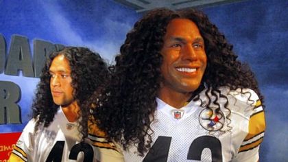 Troy Polamalu, left, poses next to "Legendaryous Troy," his wax likeness, unveiled Tuesday at Madame Tussauds in New York. The wax figure required twice the amount of hair of any other creation in the history of the famed attraction, the wax museum said in a statement.