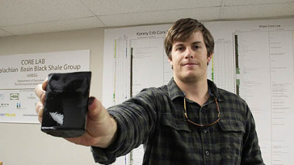 Dan Kohl, 23, a master's student in Penn State's Department of Geosciences, holds a shale core. He has a job lined up after he graduates working in Marcellus Shale for Chevron.
