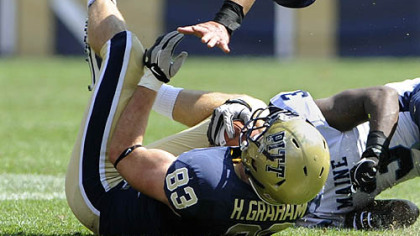 Pitt receiver Hubie Graham avoids Maine's Shawn Bodtmann to make one of his four receptions Saturday at Heinz Field.