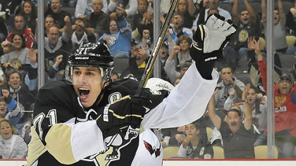 Evgeni Malkin celebrates after assisting on goal in the first period against the Capitals at the Consol Energy Center, Pittsburgh Pa.