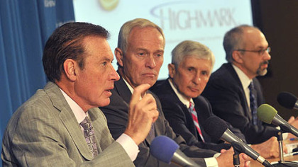 Dr. Kenneth Melani, left, president and CEO of Highmark, talks about the Highmark-West Penn Allegheny Health System merger. Also pictured, from left, J. Robert Baum, Highmark chairman; Jack Isherwood, West Penn Allegheny Health System chairman; and Dr. Keith Ghezzi, West Penn Allegheny Health System interim CEO.