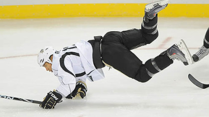 Richard Park is upended during drills the first day of camp at the Consol Energy Center. Park is back with the Penguns for the first time since 1997, when he left in a trade.