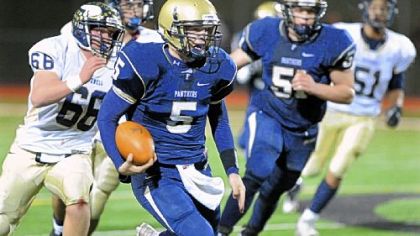 Franklin Regional quarterback Nico LoDovico runs for extra yardage against Hopewell in the second quarter.