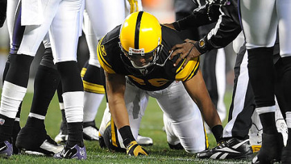 Hines Ward has trouble getting to his feet after a hit from Ravens linebacker Ray Lewis in the first half Sunday at Heinz Field.