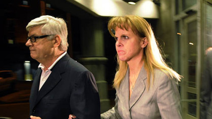 State Sen. Jane Orie, R-McCandless, leaves with her brother, Jack Orie, after her arraignment Monday on new charges.