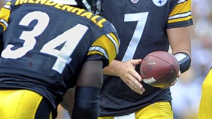 Ben Roethlisberger hands off to Rashard Mendenhall in the third quarter Sunday at Heinz Field. Mendenhall was the day's top rusher with 19 carries for 66 yards and one touchdown == in the first quarter to open up the scoring.