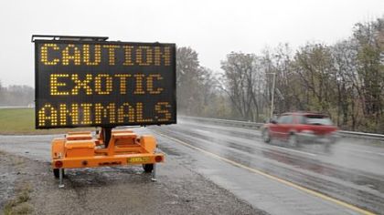 Motorists driving I-70 near Zanesville, Ohio, Wednesday encountered this warning of exotic animals on the loose.