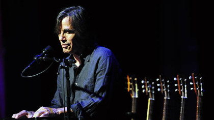 Jackson Browne, who opened his acoustic concert at Heinz Hall with "Barricades of Heaven," accompanies himself on keyboard in front of a line of guitars.