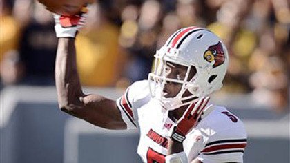Louisville quarterback Teddy Bridgewater throws a pass against West Virginia during the first quarter of Saturday's game in Morgantown.