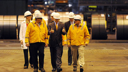 Texas Gov. Rick Perry is guided on a tour of the U.S. Steel Corp.'s Irvin Plant in West Mifflin on Friday before making an energy policy address.