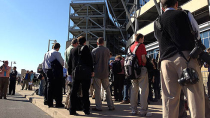 Members of the media await outside Beaver Stadium at Penn State for Coach Joe Paterno's weekly press conference. The event was canceled by university officials.