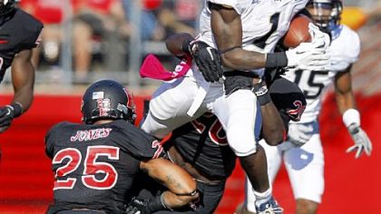 Pitt running back Ray Graham tries to jump over Rutgers defensive back Brandon Jones in the first half Saturday in Piscataway, N.J. Graham finished with 165 yards, but it wasn't enough to stop the Scarlet Knights.