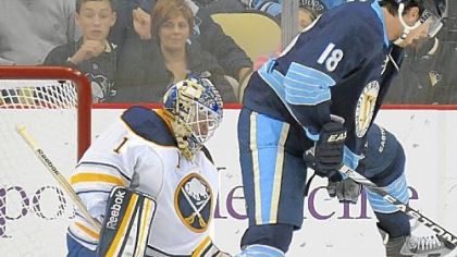 James Neal attempts to go between his legs with a shot against Buffalo goalie Jhonas Enroth Saturday at Consol Energy Center.
