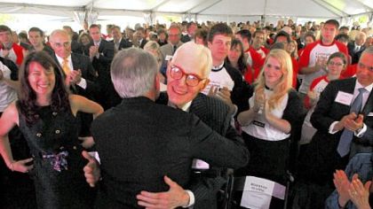 William S. Dietrich II, center, is greeted by Raymond Lane, chairman of Carnegie Mellon University's board of trustees, as his daughter, Anna Elizabeth Diemer, of San Francisco, smiles at left.