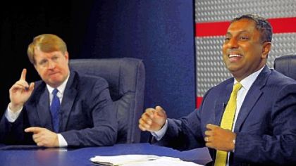 Sparks fly between Allegheny County executive candidates Rich Fitzgerald, left, and D. Raja as they disagree on issues Thursday at Robert Morris University.