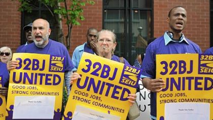 Members of SEIU Local 32BJ Luis Barrero, Gigi Tierno and William Gerner march during a rally to create and preserve family-sustaining jobs at the South Side Works, Monday afternoon, Sept. 26.