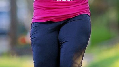 Kelley Davis runs in her neighborhood in Koppel, Beaver County, on nights after her radiation treatments.