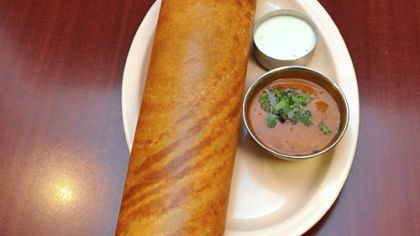 Paper masala dosa is a southern Indian specialty made with lentil and rice batter and filled with cooked potato and onion.