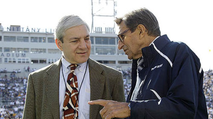 Penn State President Graham Spanier, left, talks with Coach Joe Paterno before a football game against Iowa in October in Beaver Stadium.