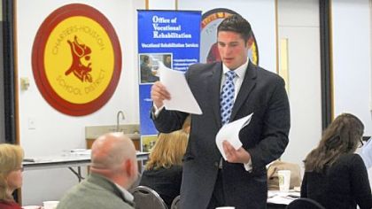 State Rep. Brandon Neuman passes out information to Washington County high school guidance counselors at the Marcellus Shale gas industry jobs forum at the Western Area Career and Technology Center in Chartiers. Mr. Neuman sponsored the event.
