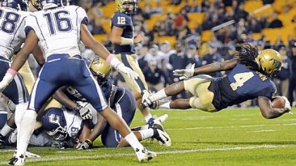 Pitt's Zach Brown dives into the end zone for a touchdown against Connecticut at Heinz Field.