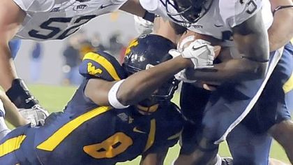 Pitt's Isaac Bennett scores a touchdown against West Virginia in the first quarter last night at Mountaineer Field in Morgantown, W.Va.