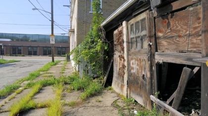 A blighted home at Tioga Street and Panke Avenue in the shadow of Pittsburgh Faison PreK-5 school on Tioga Street in Homewood.