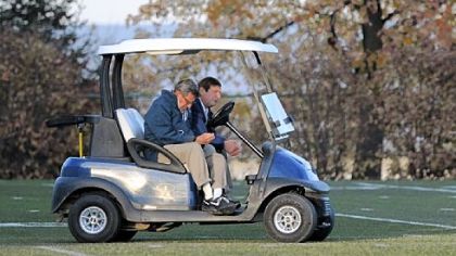 Just hours before trustees voted to remove him immediately, Joe Paterno, left,  and Tommy Venturino, director of football operations, wait for what would be Paterno's final practice as head football coach at Penn State.