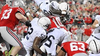 Silas Redd attempts to dive over the pile into the end zone on fourth-and-1 in the third quarter Saturday in Columbus, Ohio. He was stopped, but the Nittany Lions still prevailed to set up a showdown in Wisconsin Saturday.