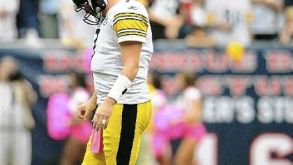 Ben Roethlisberger walks off the field slowly after being sacked by Houston for the fifth time.