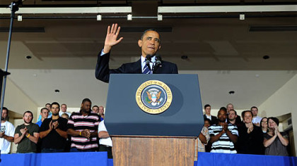 President Obama acknowledges the audience at the IBEW training center on the South Side as he speaks about his jobs bill.